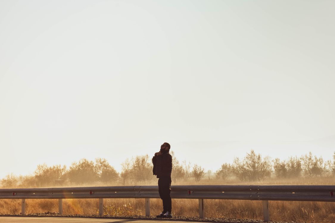 Silhouette of person alone in open space