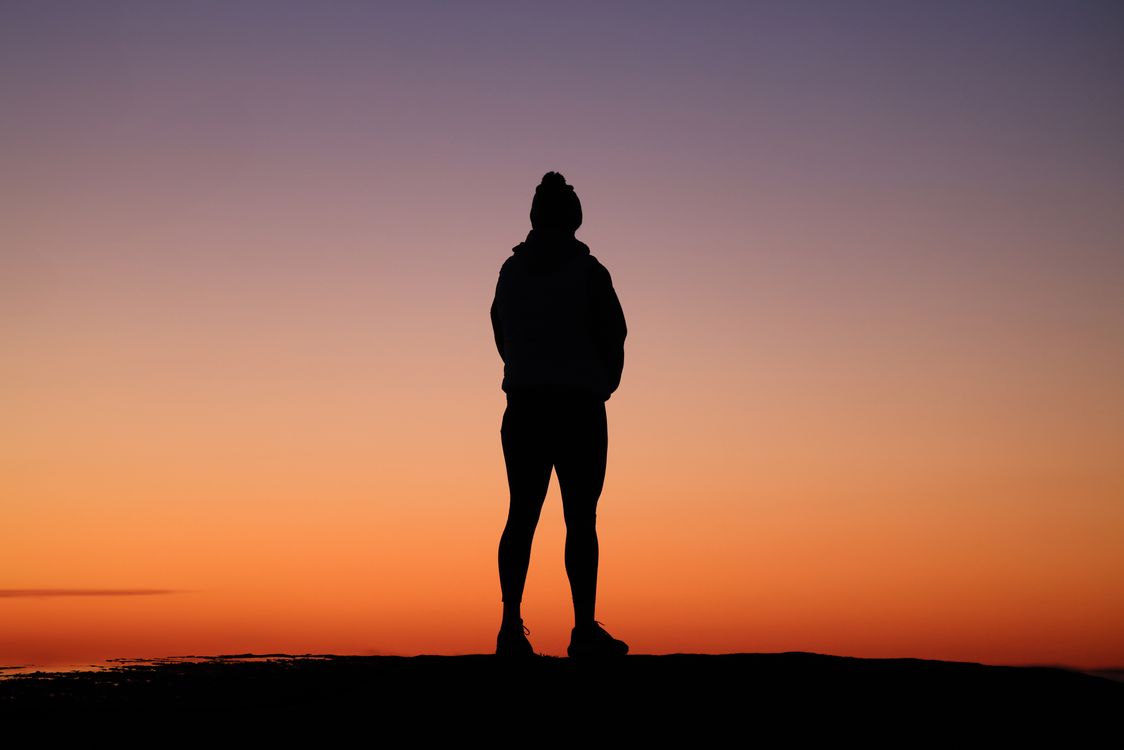 Silhouette of man at golden sunset